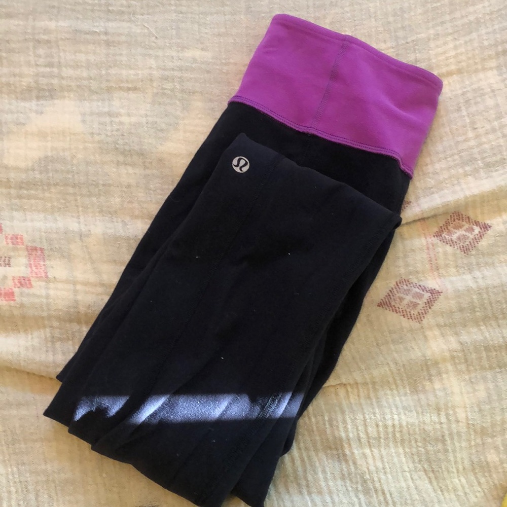 reversible lulu leggings, black with pink waistband. slight flare leg